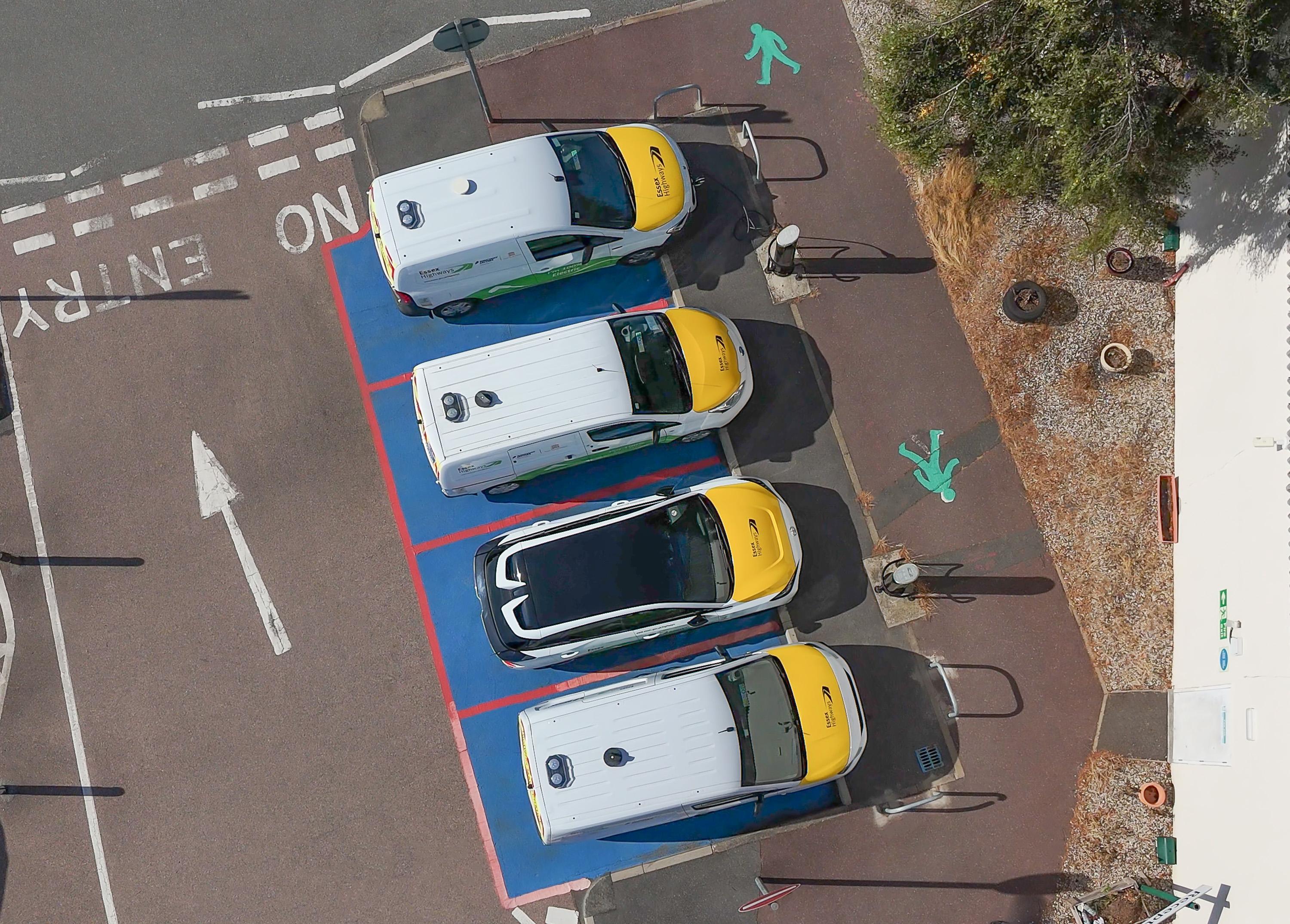 Aerial view of electric vehicles positioned on marked roadway illustrating low-emission transport at Ringway Jacobs head office