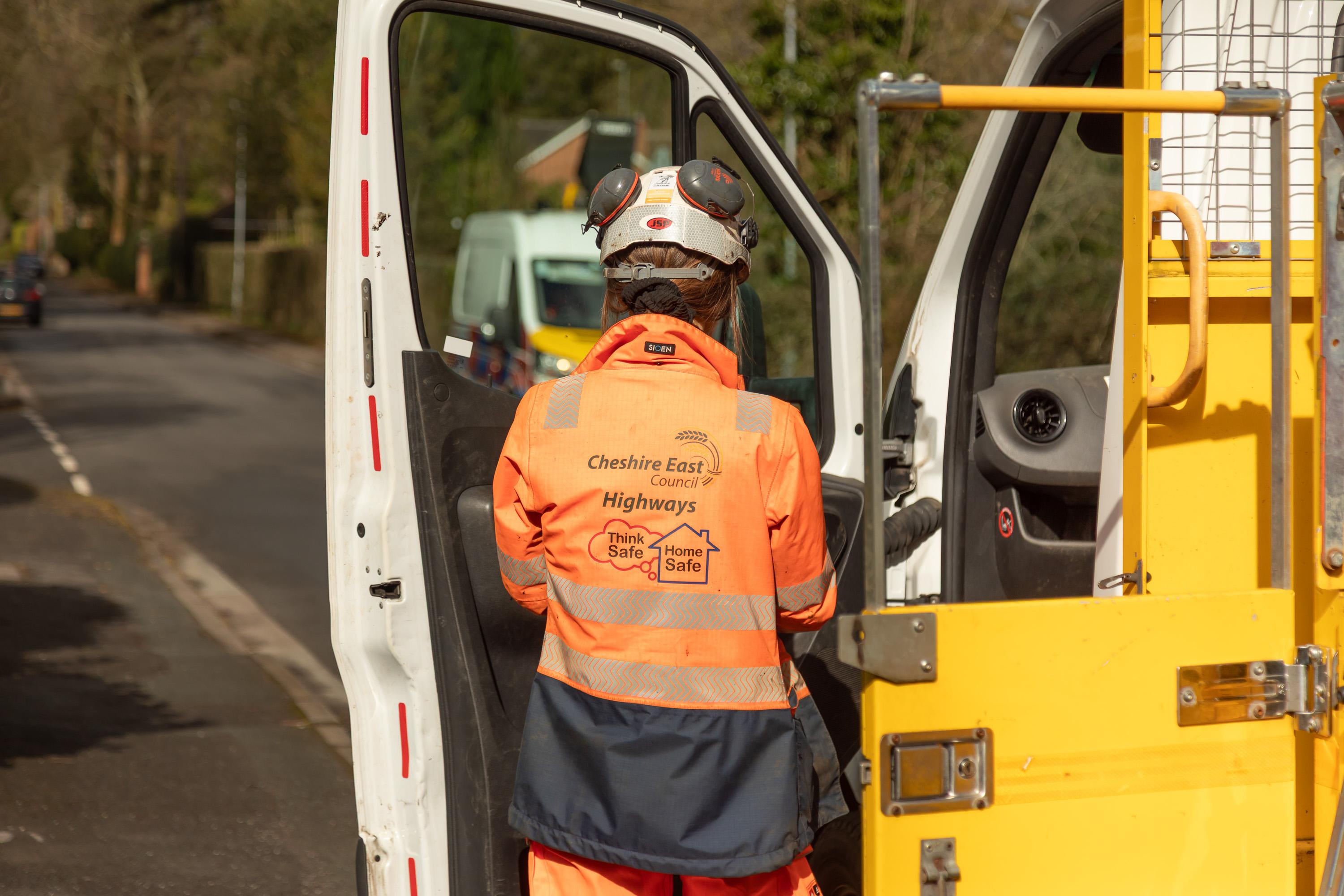 Ringway Jacobs Highway operative in PPE working beside a service vehicle as part of safe roadside maintenance operations.